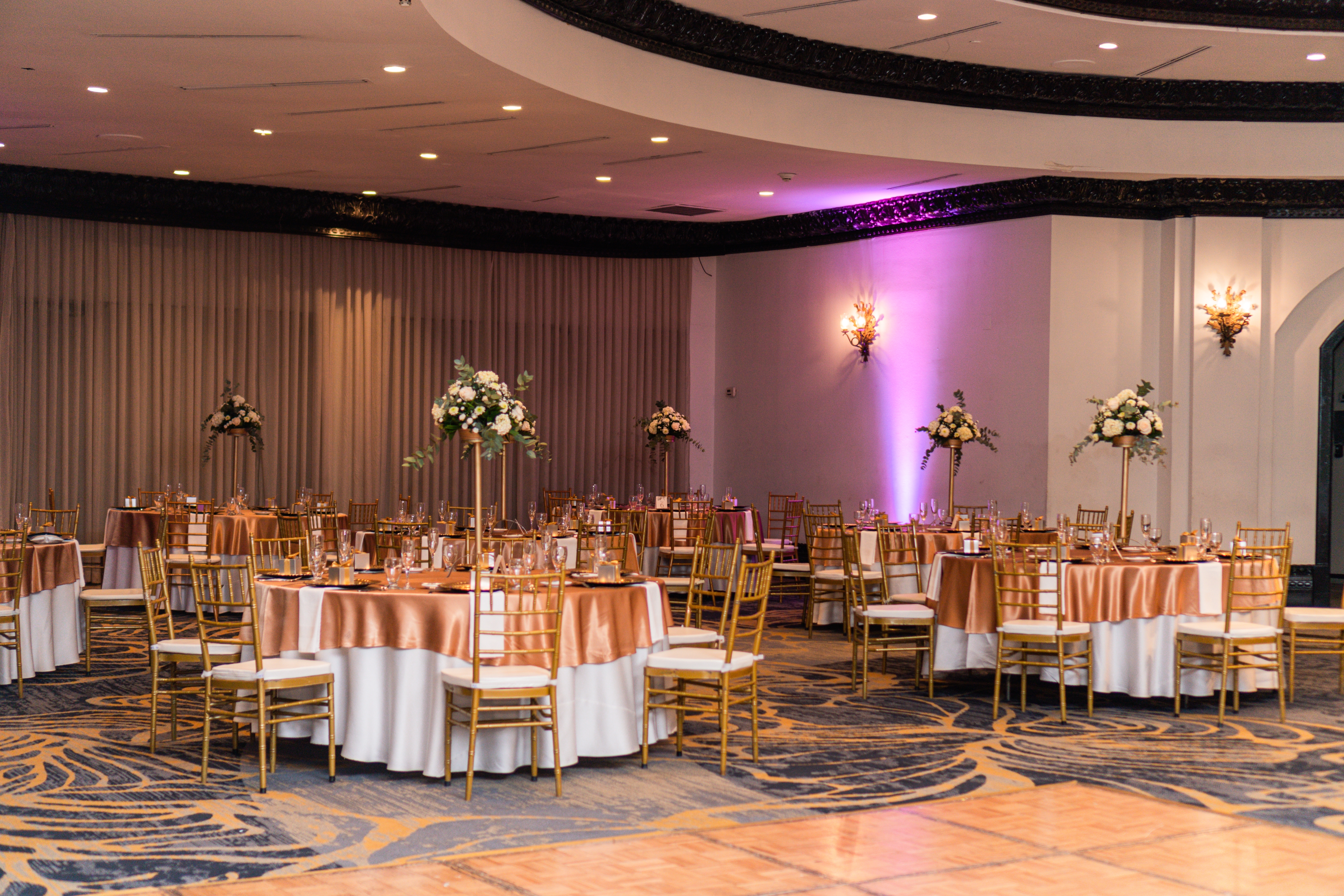 Event Room with decorated tables and chairs